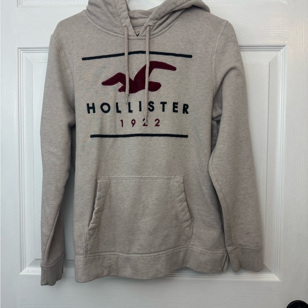 Hollister Men's Beige Hoodie with Red Logo